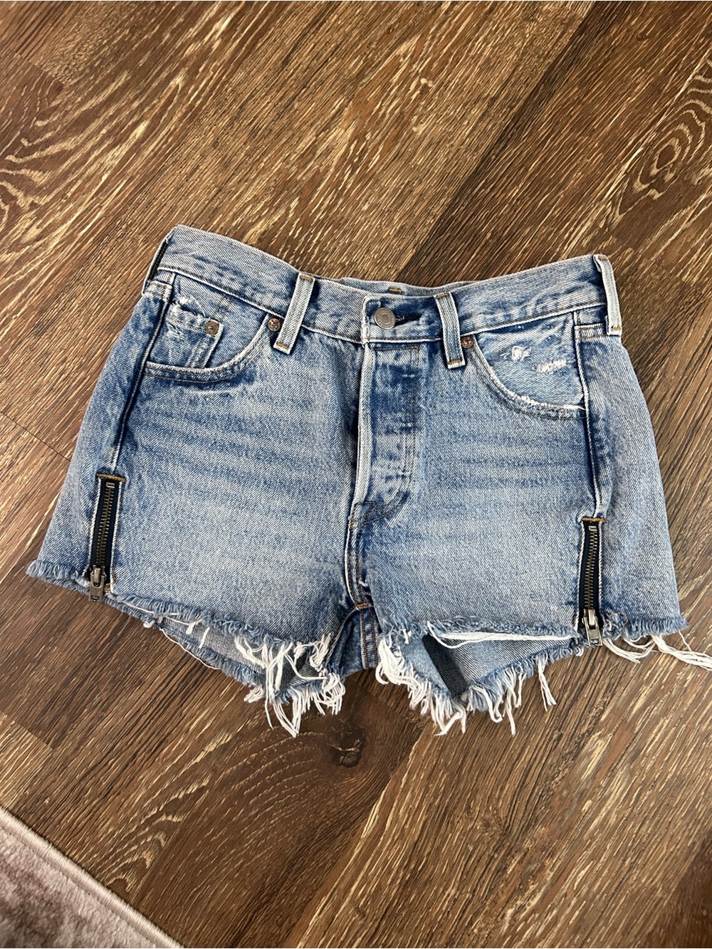 Levi's Light Blue Distressed Denim Shorties with Zipper Accents